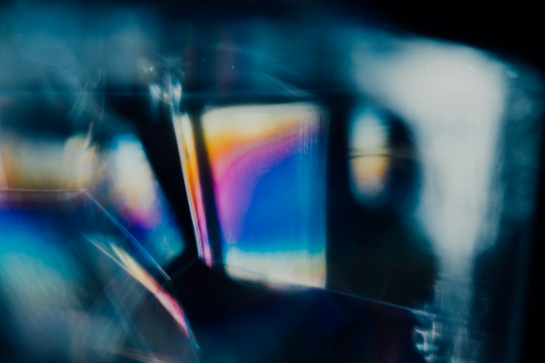 Blue and magenta light reflected through glass