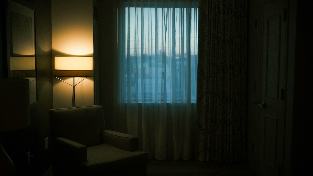 Girlfriend-Style Live Cams for Adults (18+) 14 Quiet room with window curtains and a warm lamp
