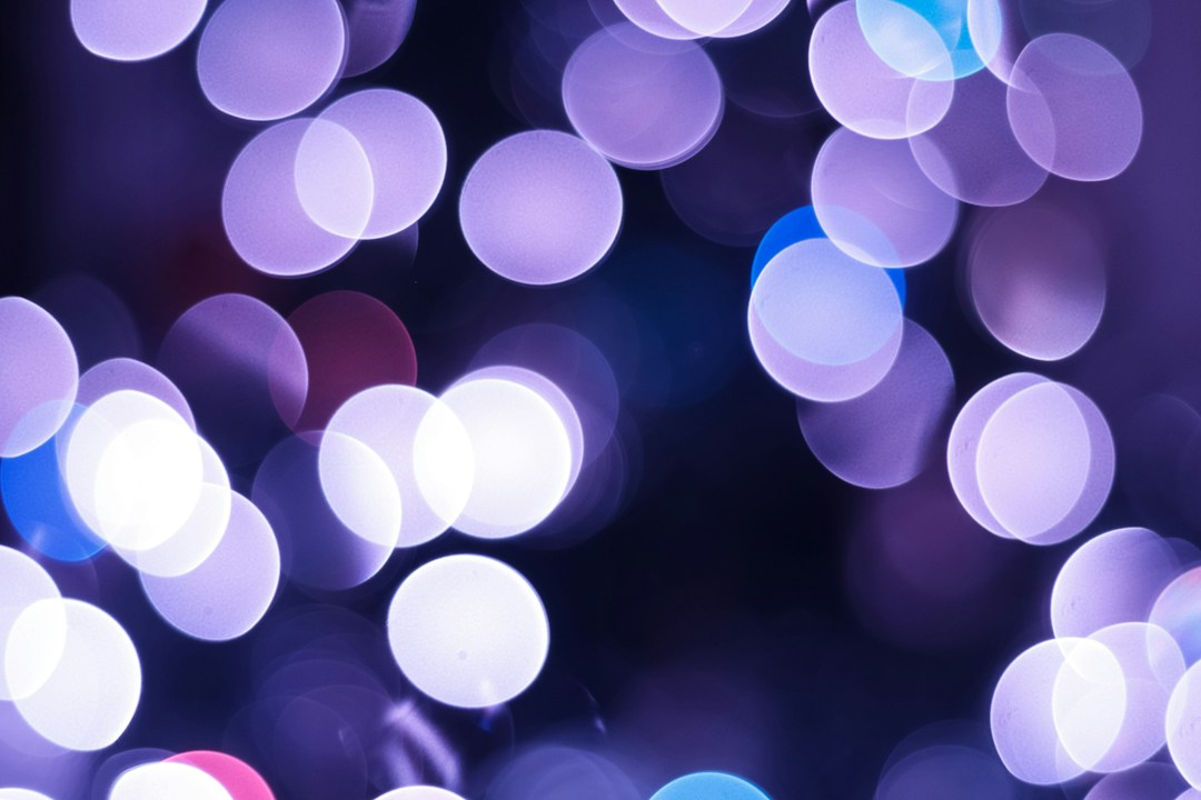 Purple, blue and white circles of light out of focus