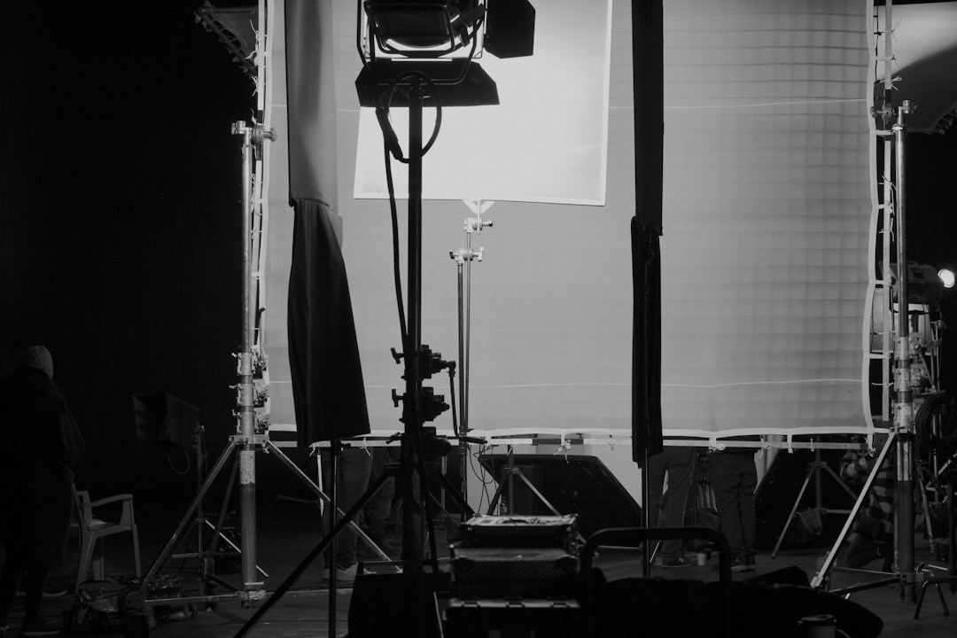 Camera and lighting stands in an empty studio